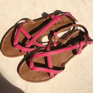 Pink and brown strappy sandals.